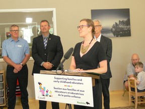 Federal Families, Children and Social Development Minister Karina Gould addresses a press conference in Winnipeg. Standing behind Gould are (left to right) Kent Paterson, president and CEO, YMCA-YWCA Winnipeg, Manitoba Education and Early Childhood Learning Minister Wayne Ewasko and Winnipeg South Centre MP Jim Carr.