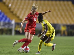 Janine Beckie of Canada fights for the ball with Deneisha Blackwood of Jamaica during the semifinal between Canada and Jamaica as part of the 2022 Concacaf W Championship at Universitario Stadium on July 14, 2022 in Monterrey, Mexico.