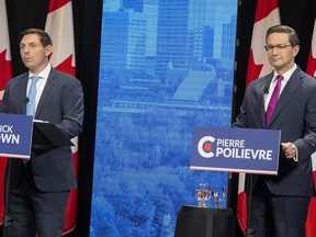 Leadership candidates Patrick Brown, left, and Pierre Poilievre, take part in the Conservative Party of Canada English leadership debate on Wednesday, May 11, 2022 in Edmonton.