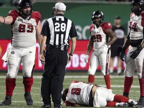 Redblacks QB  Jeremiah Masoli is injured on the field against the Roughriders on Friday. Riders defensive lineman Garrett Marino questioned the heritage of Masoli, delivered a dangerous hit to an opposing lineman, then sent Masoli to the operating table with a dirty, low hit — all in the same game.  TROY FLEECE / Regina Leader-Post