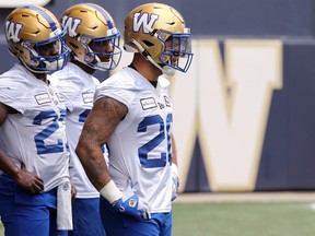 Brady Oliveira (right) with the running back group at Winnipeg Blue Bombers practice on Tues., June 21. Typically a hallmark of Bomber football, Winnipeg's run game ranks dead last in the CFL when it comes to yards per carry.