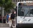 Person boards a Winnipeg Transit bus.