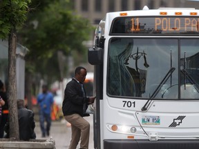 A person boards a transit bus in Winnipeg on Wednesday, July 6, 2022. The city announced a public education campaign for those riding with disabilities.