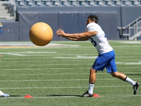 Kicker Ali Mourtada (right) throws a ball at linebacker Malik Clements during a drill at Winnipeg Blue Bombers practice in Winnipeg on Tues., July 26, 2022.