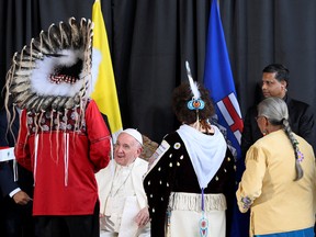Pope Francis is welcomed after arriving at Edmonton International Airport, near Edmonton, on July 24, 2022.