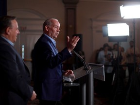 Quebec Premier Francois Legault and B.C. Premier John Horgan answer questions during a press conference on the second day of the summer meeting of the Canada's Premiers in Victoria, B.C., on Tuesday, July 12, 2022