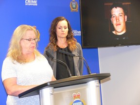 Monique Hutchison addresses the media at a press conference at Winnipeg Police headquarters on Tuesday, next to Sgt. Andrea Scott of the Winnipeg Police Missing Persons Unit with a photo of her son Robert Hutchison who was last seen on the evening of Jan. 31, 2021, on the screen in the background. Police is asking for the public's assistance in finding Hutchison who police now believe is the victim of foul play.