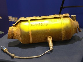 A catalytic converter engraved with a VIN number with high visible paint on display at a press conference on Monday, July 18, at Winnipeg Police headquarters to announce that a new piece of legislation aimed at protecting Manitobans from scrap metal thefts, particularly of catalytic converters, is now in effect.