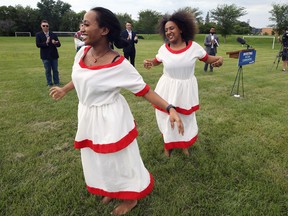 Kidist Asnakew (left) and Tsion Zebene dance prior to the announcement of a $100-million commitment to an Arts, Culture and Sport in Community Fund, at Bourkevale Community Centre in Winnipeg, on Monday, July 25, 2022.