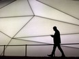 A man looks at his phone during the Mobile World Congress wireless show in Barcelona, Spain, on February 27, 2017. Xplore Mobile Inc. which supplies service to Manitoba will be shutting down at the end of August.