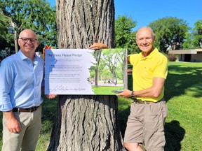 Winnipeg mayoral candidate Scott Gillingham, right, with Trees Please Winnipeg activist Charles Feaver after Gillingham signed the "Trees Please Pledge."