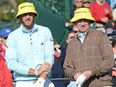 Dustin Johnson, left, and Wayne Gretzky wait on the 17th tee during the third round of the AT&T Pebble Beach National Pro-Am at Pebble Beach Golf Links on February 9, 2013 in Pebble Beach, Calif.