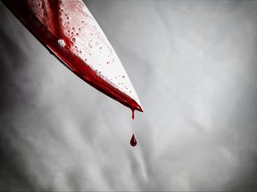 A bloody knife is pictured in this photo illustration.