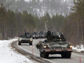 Swedish Army armoured vehicles and tanks participate in a military exercise called "Cold Response 2022", gathering around 30,000 troops from NATO member countries as well as Finland and Sweden, amid Russia's invasion of Ukraine, in Setermoen, Norway, March 25, 2022.