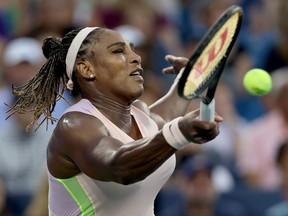 Serena Williams returns a shot to Emma Raducanu of Great Britain during the Western & Southern Open at Lindner Family Tennis Center on August 16, 2022 in Mason, Ohio.