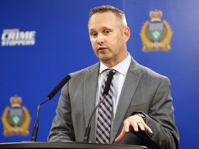 Sgt. Trevor Thompson with the Winnipeg Police Service financial crime unit speaks during a press conference to announce added funding to fight cybercrime on Wednesday, Aug. 3.
