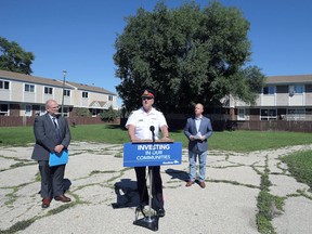 Insp. George Labossiere (centre), commander of the Winnipeg Police Service community support division, with
Justice Minister Kelvin Goertzen (left) and Rossmere MLA Andrew Micklefield, speaks about funding for the Neighbourhood Watch program, near the Donwood Family Resource Centre in the North Kildonan area of Winnipeg, on Tues., Aug. 30, 2022.