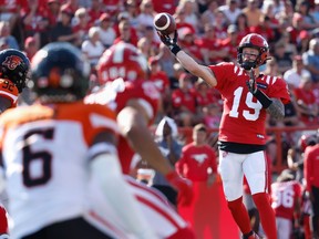 Calgary Stampeders quarterback Bo Levi Mitchell throws a touchdown pass to Jalen Philpot against the B.C. Lions at McMahon Stadium in Calgary on Aug. 13, 2022.