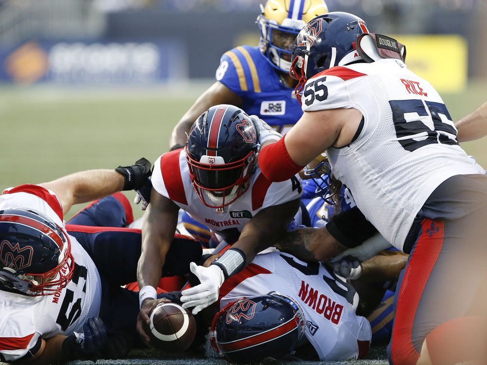 Montreal Alouettes quarterback Dominique Davis hands the ball off