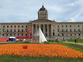 An encampment on the front lawn of the Manitoba legislature building as shown on Wednesday Aug. 17, 2022 in Winnipeg. A handful of police were present as eviction notices were given to demonstrators on the north and east sides of the legislative building Wednesday morning.