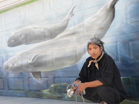 Winnipeg artist Nereo Zorro, seen here at the site of a mural he painted in a back lane along William Avenue, is working on a new project, as he tries to use art and murals to bring a little more brightness and colour to Winnipeg's back lanes.