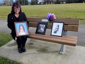 Carol Todd sits on a memorial bench dedicated to her daughter Amanda in Settlers Park in Port Coquitlam on Dec. 3, 2020. Amanda, in the photos with Carol, took her own life in 2012 after becoming a victim of cyberbullying. Amanda's birthday was Nov. 27, and someone decorated the bench and the area around it with purple flowers. For Lori Culbert story. Trax assignment ID# 00063199A Credit: Mike Bell/PNG [PNG Merlin Archive]