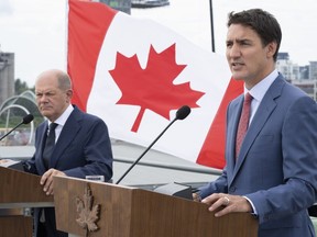 Prime Minister Justin Trudeau, right, responds to a question next to German Chancellor Olaf Scholz during a news conference in Montreal, Monday, Aug. 22, 2022.