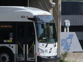 A Winnipeg Transit bus exits a Transit garage in Winnipeg.