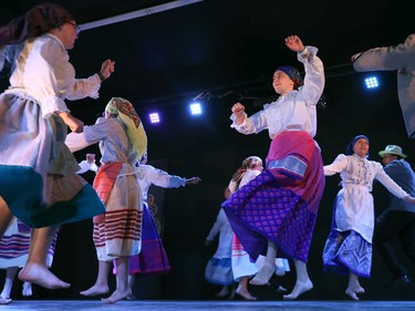 A dance group performs barefoot at the Folklorama Casa do Minho Portuguese pavilion on Wall Street in Winnipeg on Monday, Aug. 1, 2022.