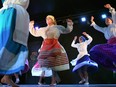 A dance group performs barefoot at the Folklorama Casa do Minho Portuguese pavilion on Wall Street in Winnipeg on Monday, Aug. 1, 2022.