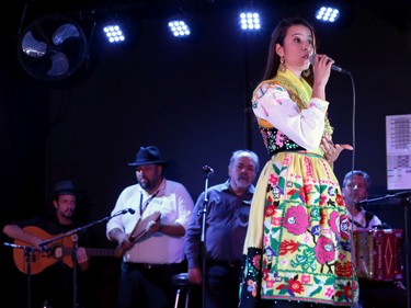 A singer performs with a band at the Folklorama Casa do Minho Portuguese pavilion on Wall Street in Winnipeg on Monday, Aug. 1, 2022.