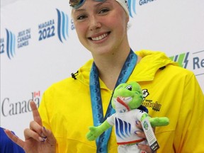 Winnipeg's Mia West, 16, celebrates after winning Team Manitoba's first gold medal in swimming's 200m butterfly event at the 2022 Canada Summer Games in Niagara, Ont., on Monday.