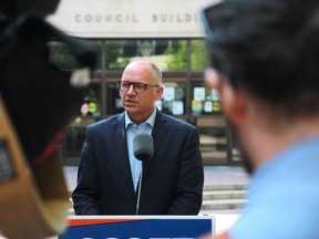 Winnipeg mayoral candidate Scott Gillingham speaks during a campaign announcement outside city hall on Monday, Sept. 12.