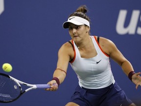 Bianca Andreescu returns a shot to Caroline Garcia of France during the third round of the U.S. Open tennis championships in New York City, Friday, Sept. 2, 2022.