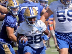Bombers rookie RB Greg McCrae carries the ball during practice on Thursday. He’ll start for the injured Greg Ellingson and Janarion Grant this Sunday.  KEVIN KING/Winnipeg Sun