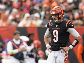 Cincinnati Bengals quarterback Joe Burrow pauses between plays during the first half of an NFL football game against the Pittsburgh Steelers, Sunday, Sept. 11, 2022, in Cincinnati. Burrow, who did not play a snap in the pre-season, had a horrific, turnover-filled season opener.