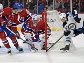 Winnipeg Jets forward Cole Maier scores a goal against Montreal Canadiens goalie Cayden Primeauat the Bell Centre Thursday night.  
USA TODAY SPORTS