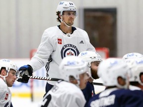 Last year’s unhappiness seems to be in the rearview mirror for Mark Scheifele, seen here at training camp yesterday. 
KEVIN KING/Winnipeg Sun