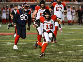 Redblacks quarterback Nick Arbuckle escapes the Alouettes pass rush and runs for a first down in the opening half of play on Friday night.