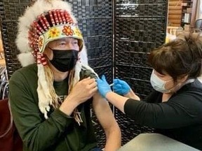 Nisichawayasihk Cree Nation Chief Marcel Moody is seen getting a COVID booster shot back in March. NCN Chief and council have put in strict COVID regulations in the community, as they say the COVID virus continues to spread, and cases continue to spike.