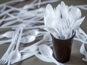 Plastic spoons, forks and knives are seen in this stock image.