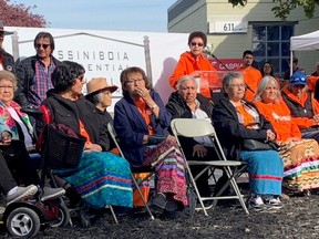 Residential school survivors mark the opening of the Assiniboia Residential School Commemorative Monument on Academy Road in Winnipeg on Friday, Sept. 30, 2022. Survivors and Elders welcomed members of the community and political leaders in attendance as they shared their own truths and reflected on the ongoing impacts of Canada?s Indian Residential School system. Assiniboia Residential School was one of only a few urban residential schools in Canada and the first residential high school in Manitoba. Between 1958 and 1973, more than 765 students attended Assiniboia, primarily from Manitoba communities where there were no high schools.