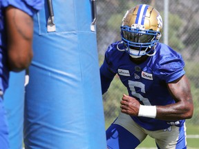 Willie Jefferson charges a tackling dummy during Winnipeg Blue Bombers practice on Mon., Aug. 22, 2022.