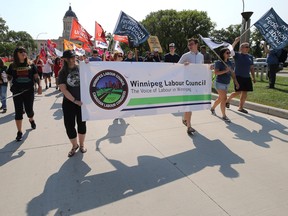 The Labour Day March exits Memorial Park on its way to picnic in Vimy Ridge Park in Winnipeg on Monday, Sept. 5, 2022.