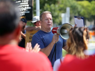 Kevin Rebeck, president of the Manitoba Federation of Labour, speaks at Memorial Park ahead of the Labour Day March in Winnipeg on Monday, Sept. 5, 2022.