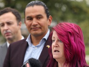 Sandy Cohen, who along with partner Rob is a Grace Hospital patient, discusses their struggles during an NDP press conference near the hospital on Portage Avenue in Winnipeg on Wed., Sept. 14, 2022. At her right are NDP Leader Wab Kinew and Adrien Sala, NDP MLA for St. James. KEVIN KING/Winnipeg Sun/Postmedia Network