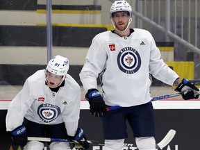 Pierre-Luc Dubois (right) with Cole Perfetti at Winnipeg Jets training camp at Bell MTS Iceplex on Thursday, Sept.  22, 2022.