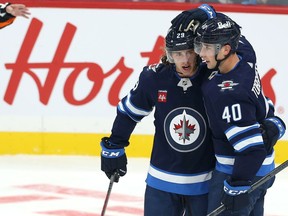 Winnipeg Jets forward Daniel Torgersson (right) is congratulated on his goal against the Ottawa Senators with Alex Limoges in NHL exhibition action at Canada Life Centre on Tuesday, Sept. 27, 2022.