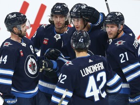 Winnipeg Jets forward Daniel Torgersson (centre) celebrates his goal against the Ottawa Senators with Josh Morrissey, Alex Limoges, Simon Lundmark and Dominic Toninato (from left) during NHL exhibition action at Canada Life Centre on Tuesday, Sept. 27, 2022.