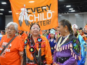 Elders march during the Grand Entry at the second annual Orange Shirt Day Powwow in Winnipeg on Friday, Sept. 30, 2022.